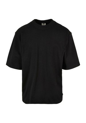 T-shirt noir à manches courtes en coton doux. Il présente un col rond, une coupe décontractée et un ourlet incurvé pour un confort supplémentaire.