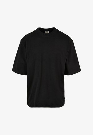 Mustade lühikeste varrukatega t-särk, mis on valmistatud pehmest puuvillast. Omab ümmargust kaelust, laia lõiget ja kõverat hemipinda lisamugavuse tagamiseks.