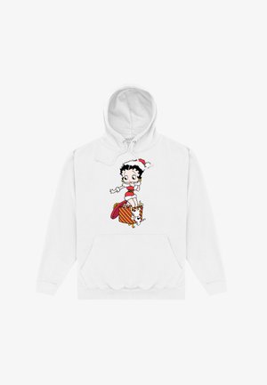 Hvid hættetrøje med en tegneseriefigur iført en juleslædehat, stående på en gaveæske, med en hund ved siden af hende.