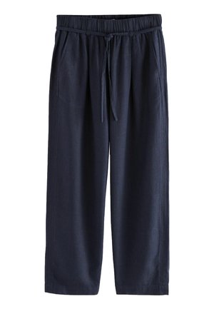 Tumedate linased culotid elastse vöökoha ja nööriga, mis on varustatud küljetaskutega ning neil on lahtine, lühendatud lõige.
