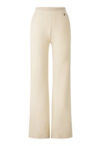 Cremfarbene weit geschnittene Hose mit geripptem Taillenbund, aus weichem Stoff, mit seitlichen Taschen und einem minimalen Metall-Logo-Element.