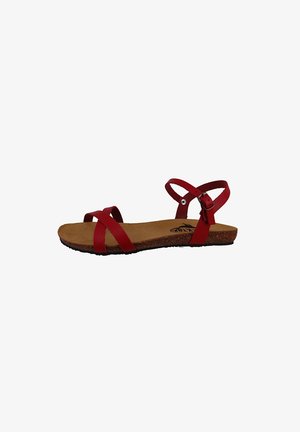 Red flat sandals with two crossed straps and an adjustable ankle strap, featuring a textured cork sole and a smooth, shiny finish.