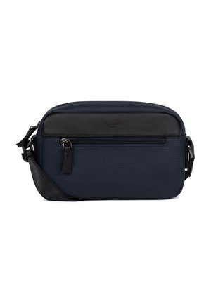 Petit sac bandoulière bleu marine avec panneau supérieur noir et poche avant zippée, sangle noire réglable et tirettes de fermeture éclair en métal.