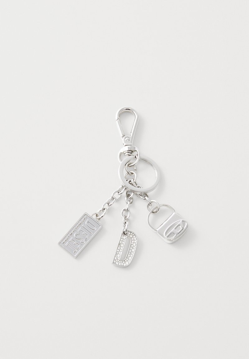 Silver keychain with clips, featuring three charms: a rectangular tag engraved "Diesel," a metallic letter "D," and a small lock shape.