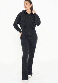 LEGEA TRIXY - Felpa con zip - nero