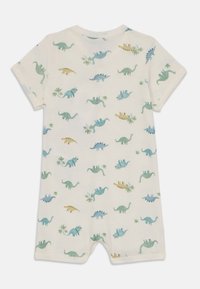 Kortermet, kremfarget dress med dinosaurmønster i blått, grønt og gult, laget av mykt stoff; har trykknapplukking nederst.