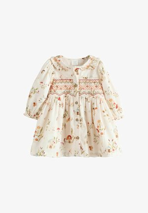 Virágmintás krém színű ruha, amelyet ráncolt derék, hosszú puffos ujjak, ráncolási részletek és gombos zárás jellemez az elején.