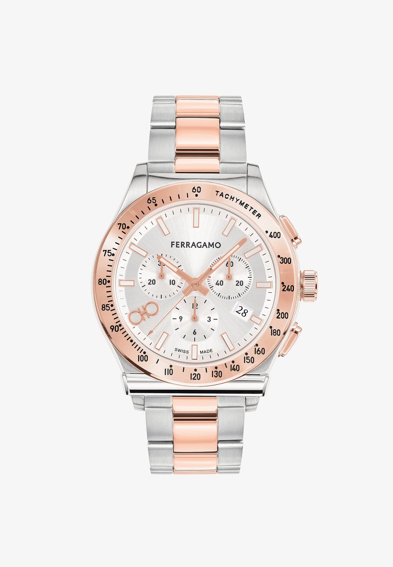 Montre chronographe en acier inoxydable argenté avec des accents en or rose. Présente un cadran blanc, trois sous-cadrans et un affichage de la date à 6 heures.