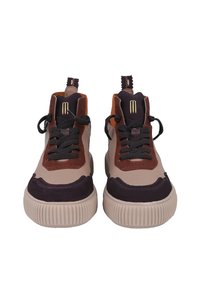 Mid-top sneakers featuring a mixture of tan, brown, and purple suede and leather. Thick, ridged sole; flat black laces; pull tab at the heel.