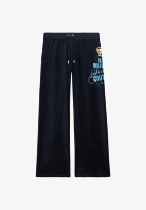 Pantaloni da jogging in velluto blu navy con vita elasticizzata e dettagli oro. Presentano testo stampato blu e una grafica di una corona sulla gamba sinistra.
