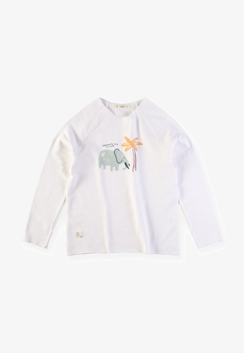 Maglietta bianca a maniche lunghe con design raglan, caratterizzata da un'illustrazione di un elefante blu chiaro e da una palma gialla, con testo sopra.