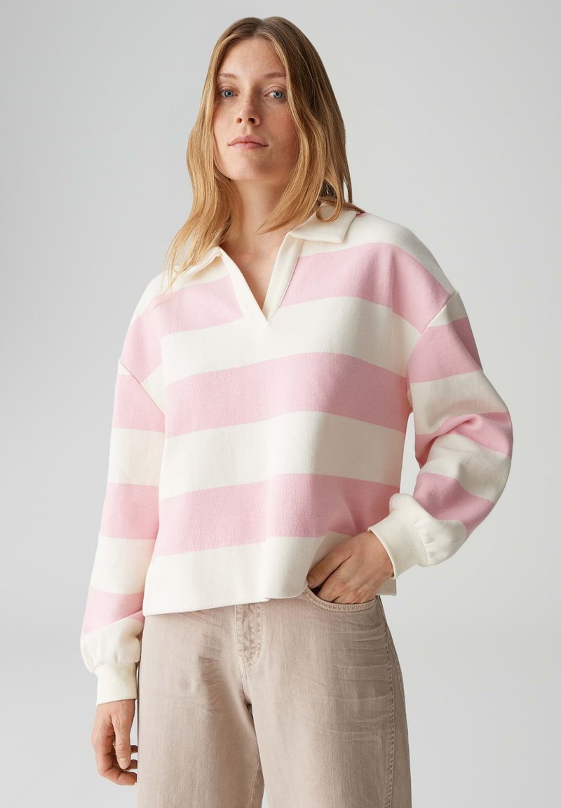 Gebreide trui met V-hals, met afwisselende roze en witte strepen, lange mouwen en geribbelde manchetten. Gestructureerde stof met een comfortabele pasvorm.