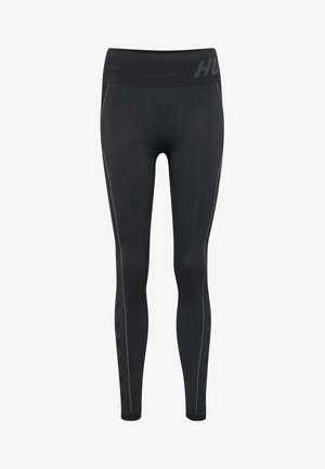 Svarta träningstights med en ribbad textur, försedda med ett högt, elastiskt midjeband och diskreta reflekterande detaljer längs sidorna.