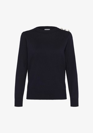 Tumesinine kampsun soonikkoes, ümmarguse kaeluse ja pikkade varrukatega. Vasakul õlal on kaunistuseks hõbedased nööbid.