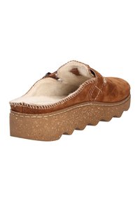 Brown suede slip-on clog with a thick, textured sole, white stitching, and soft, fluffy cream interior lining.