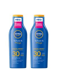 Two blue bottles of Nivea Sun sunscreen with yellow caps. Labels feature white and pink text, highlighting SPF 30 and key ingredients.