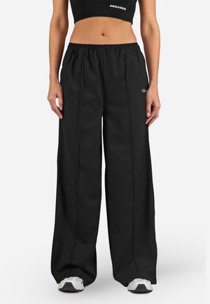 NILAY  - Tracksuit bottoms - black