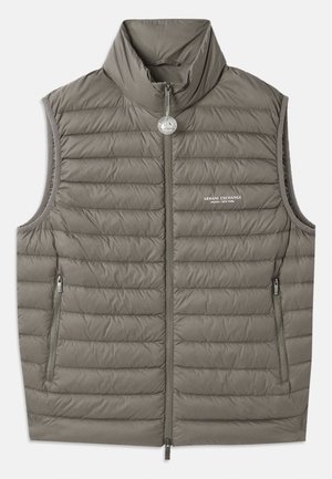 Puffer vest in muted gray, featuring a high collar, zip front, and two side pockets. Lightly textured with quilted stitching detail.