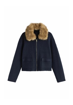 Navy blue wool jacket with large tan faux fur collar, front zipper, and two front pockets.