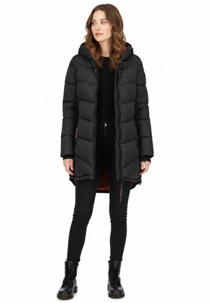 Black puffer coat with a hood, featuring a quilted design and orange lining, paired with black pants and lace-up boots.