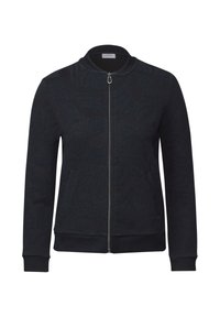 Chaqueta negra con cremallera y un patrón de olas texturizado. Presenta un cuello, puños y cinturilla acanalados, fabricada con un suave tejido de punto.