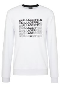 Sudadera blanca con múltiples impresiones en negro del texto "KARL LAGERFELD", cuello redondo y mangas largas con puños y dobladillo de canalé.