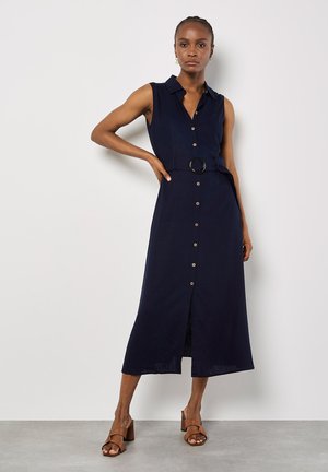 Marineblaue ärmellose Knopfleiste-Kleid mit tailliertem Bund und seitlichem Schlitz. Gefertigt aus einem leichten Stoff mit glatter Textur und goldfarbenen Knöpfen.
