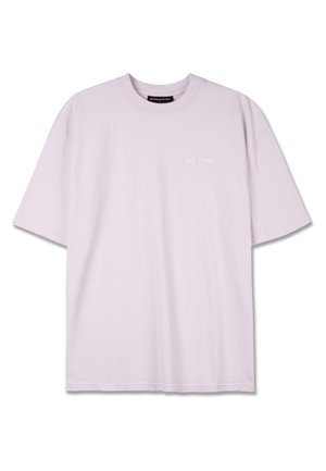Maglietta oversize di un delicato lavanda realizzata in morbido cotone con scollo rotondo. Presenta un ricamo del logo discreto sulla parte anteriore e maniche corte.