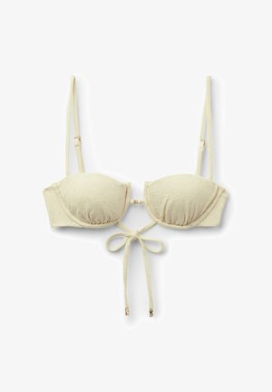 Góra bikini w kremowej teksturze z regulowanymi ramiączkami i wiązaniem z przodu z ozdobami w złotym kolorze na końcach.