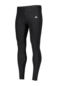 Zwarte sportleggings van rekbaar materiaal, met een getailleerd ontwerp en een elastische tailleband. Klein wit logo aan de zijkant.