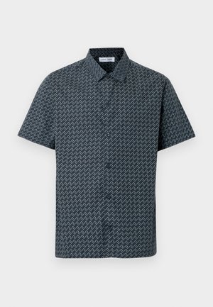 Camicia a maniche corte color blu navy con motivo a zigzag bianco. Presenta un colletto classico e una chiusura frontale con bottoni. Tessuto dalla texture liscia.