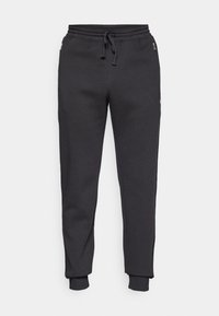 Sorte tapered sweatpants med elastisk talje, snørre, lynlåslommer i siden og ribbede ankler.