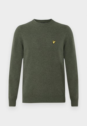 Pull en tricot vert avec des manches longues, un col rond et un petit logo d'oiseau jaune sur la poitrine gauche. Texture douce et design décontracté.