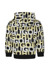 Sweat à capuche avec un motif graphique mélangé de grandes lettres jaunes, noires et blanches sur fond noir. Poignets et ourlet côtelés.