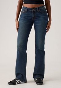 Levi's® SUPERLOW BOOTCUT - Jeans bootcut - sweep down