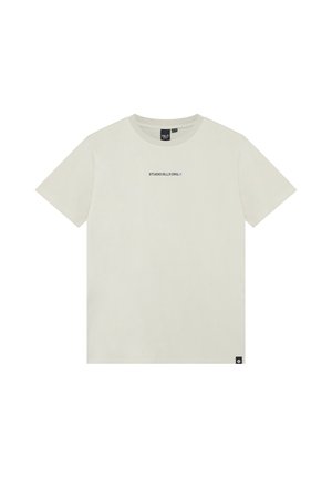 Ljusbeige kortärmad t-shirt med rund halsringning och liten svart text "STUDIO RLLX.ORG." på bröstet samt liten svart etikett vid nederkanten.