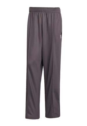 Grijze sportbroek van lichtgewicht stof. Voorzien van een elastische tailleband en rechte snit. Inclusief een klein logo aan de zijkant.