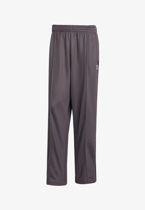 Graue Sporthose aus leichtem Stoff. Mit elastischem Bund und geradem Schnitt. Beinhaltet ein kleines Logo an der Seite.