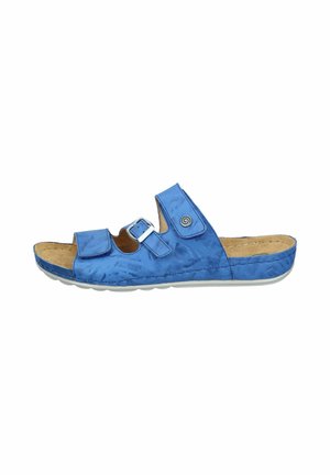 Blue open-toe slide sandal with two adjustable straps, a buckle, a cushioned tan footbed, and a white sole.