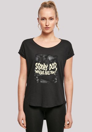 Black short-sleeve t-shirt in a relaxed fit featuring a graphic print of a haunted house and the text "Scooby Doo Where Are You?" in yellow.