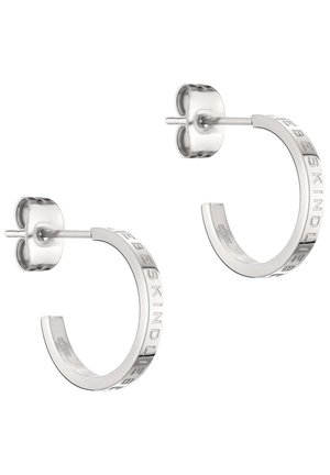 Silver metal semi-hoop earrings with stud backs, featuring engraved brand name "LIEBESKIND" on outer surface.