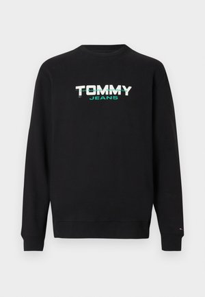 Musta collegepaita pyöreällä pääntiellä, jossa valkoinen ja turkoosi "TOMMY JEANS" -grafiikka. Resorireunat hihansuissa ja helmassa, pehmeä kangaspinta.