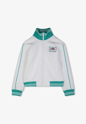 Witte jas met ritssluiting en turquoise accenten, geribbelde kraag, manchetten en zoom. Voorzien van steekzakken aan de zijkant en een logo-patch op de borst.