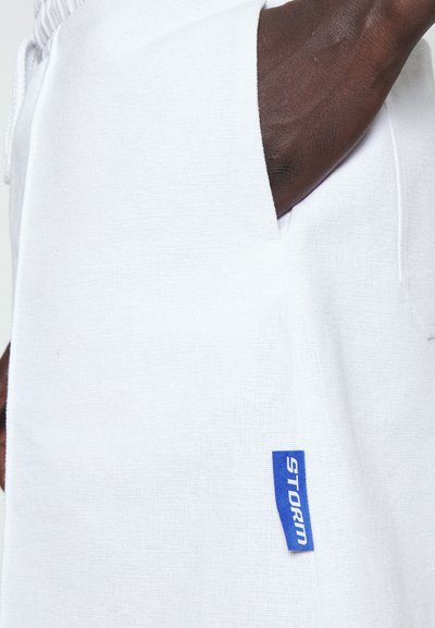 Nikolaj Storm CYRUS PIN UNISEX - Παντελόνι φόρμας - white