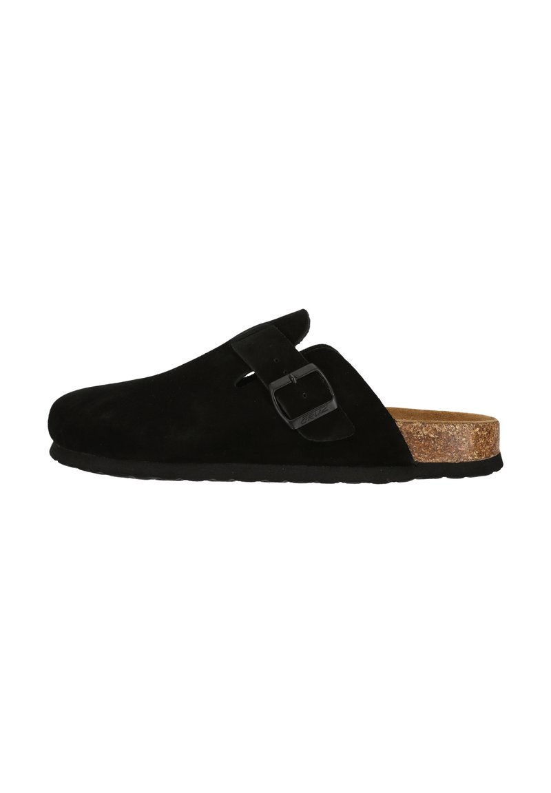 Svart mockasko i slip-on stil med en korkfotbädd, med en sidobuckle som accent och en rundad tådesign. Mjuk textur och platt sula.