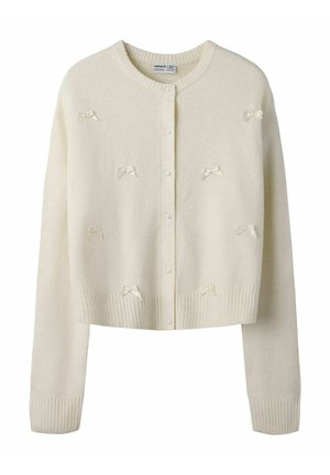 Kremfarbener gestrickter Cardigan mit Perlenknöpfen und kleinen passenden Ripsband-Schleifen, mit rundem Ausschnitt sowie gerippten Bündchen und Saum.