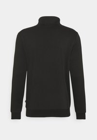 Black sweatshirt with a high collar, long sleeves, and ribbed cuffs. Smooth texture, minimalistic design, and no visible patterns.