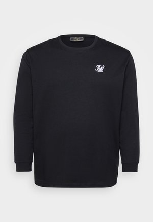 Fekete hosszúujjú póló, pamutból készült, fehér hímzett logóval a mellkason, bordázott nyakkal és mandzsettákkal.