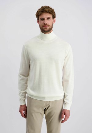 Crème turtleneck trui met lange mouwen, gemaakt van zacht materiaal. Kenmerkt zich door een aansluitend ontwerp en geribde mouwen en zoom. Gekocht met lichte beige broeken.
