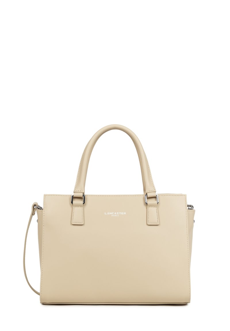 Sac à main rectangulaire en cuir beige avec deux poignées, bandoulière amovible et ferrures argentées, marqué du logo "Lancaster Paris" au centre avant.